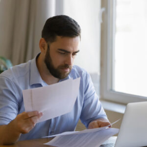 man looking at documents