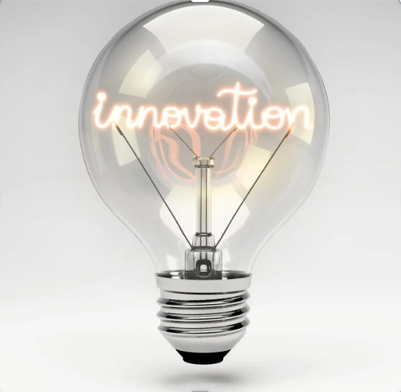 A light bulb with the word “innovation” glowing inside the filament, symbolizing creativity, ideas, and forward thinking.