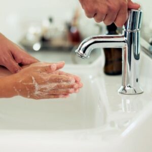 cleaning hands at sink