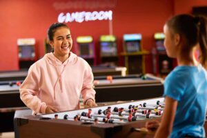 kids playing foosball