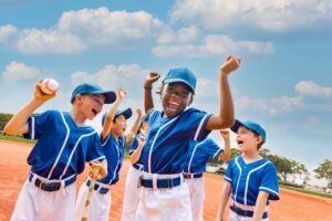 boys baseball team celebrating