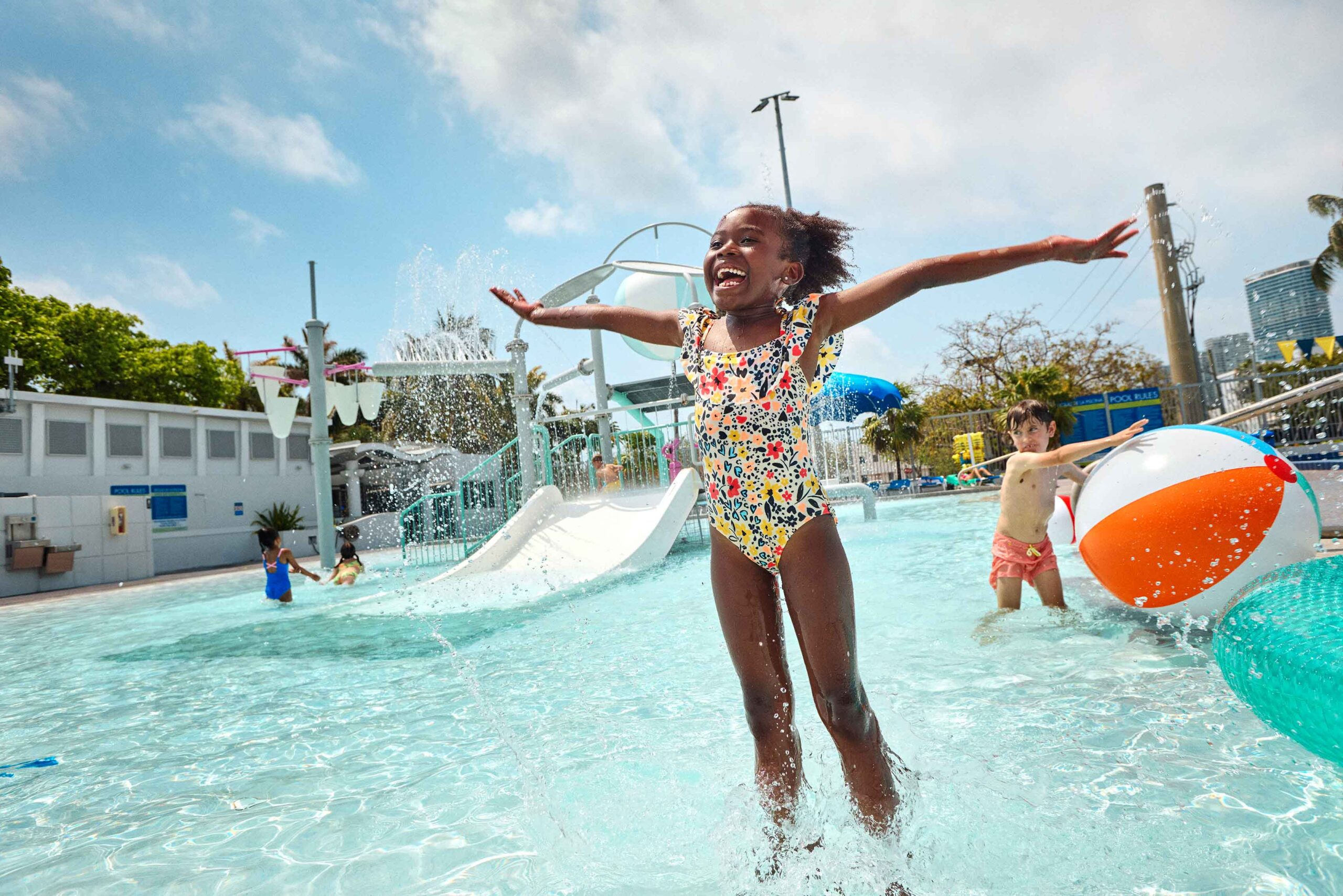 girl jumping in pool