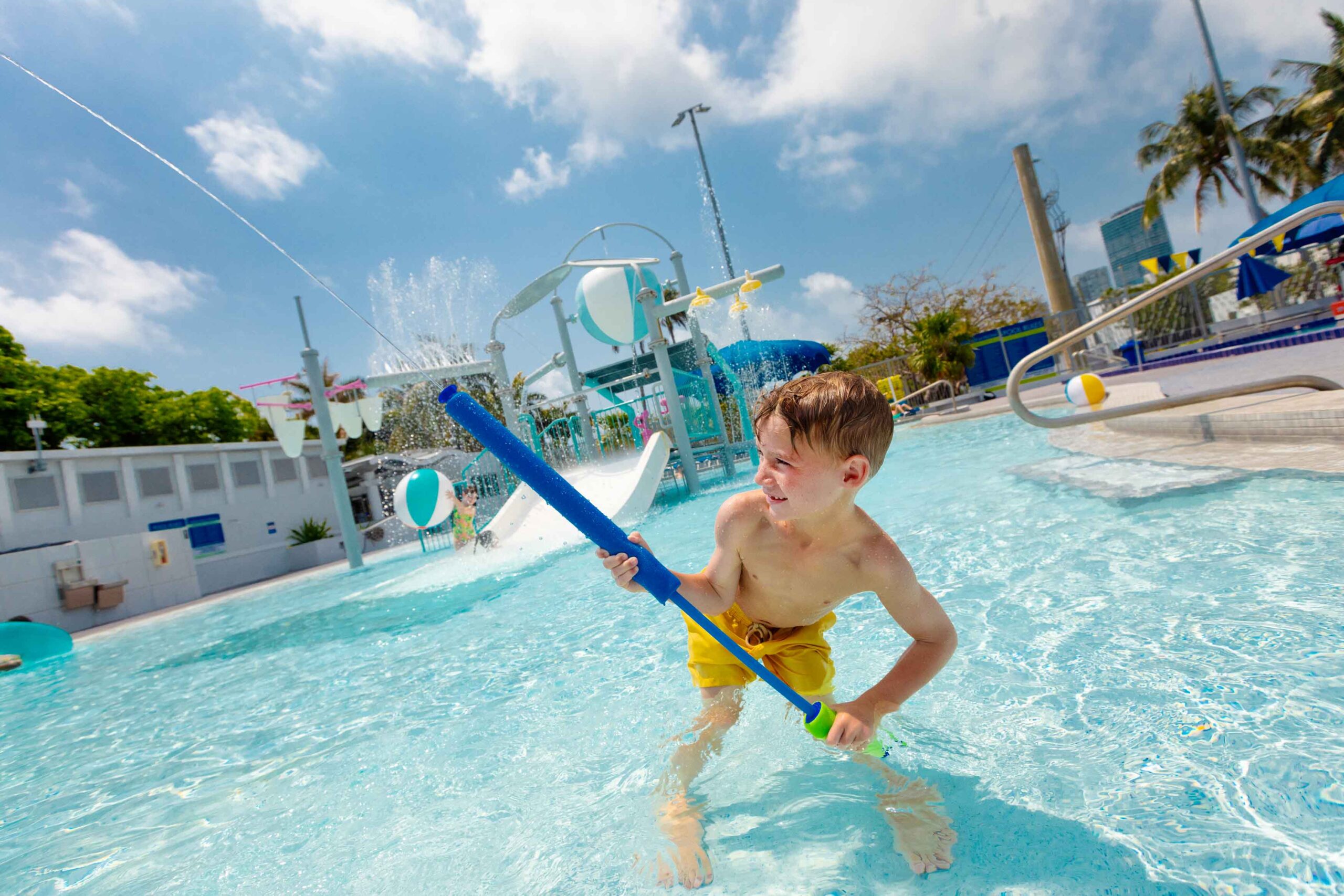 boy playing in pool