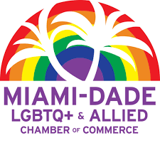 Miami‑Dade LGBTQ+ & Allied Chamber of Commerce logo featuring a stylized white palm tree over a rainbow background.