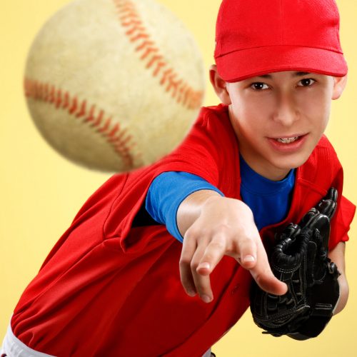 boy throwing a baseball