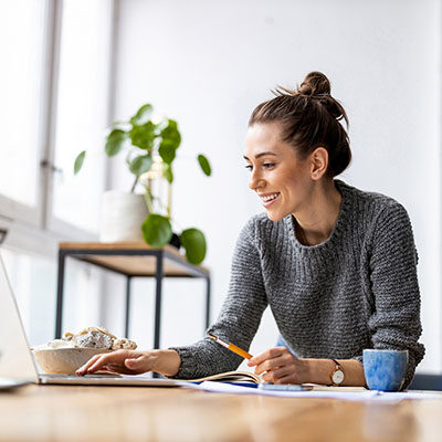 Woman at her desk on her computer